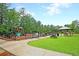 Fenced playground area with picnic shelter and tables, ideal for Gathering fun at 3364 Middlesboro Ave, Summerville, SC 29485