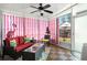 Bright sunroom with red and white striped curtains and comfortable wicker seating at 3364 Middlesboro Ave, Summerville, SC 29485