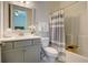 Bathroom featuring a vanity and a tub/shower with white and gray striped curtain at 3539 Habenaria Rd # 28, Mount Pleasant, SC 29466