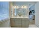 Bright bathroom featuring a double sink vanity with a large mirror and modern lighting at 3539 Habenaria Rd # 28, Mount Pleasant, SC 29466