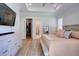 This bedroom has wood-look floors and features a walk-in closet and ensuite bathroom at 3539 Habenaria Rd # 28, Mount Pleasant, SC 29466