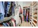 Walk-in closet with custom shelving and ample hanging space for clothes and shoes at 3539 Habenaria Rd # 28, Mount Pleasant, SC 29466