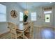 Cozy dining space featuring a wooden table, stylish chairs, and a decorative light fixture for a welcoming ambiance at 3539 Habenaria Rd # 28, Mount Pleasant, SC 29466