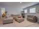 Spacious living room with a large sectional sofa, ottoman, and plush area rug at 3539 Habenaria Rd # 28, Mount Pleasant, SC 29466