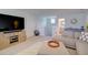 Comfortable living room with a large TV, sectional sofa, and neutral decor at 3539 Habenaria Rd # 28, Mount Pleasant, SC 29466
