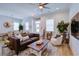 Bright living room with stylish decor, including a comfortable sofa, accent chair, and wooden coffee table at 3539 Habenaria Rd # 28, Mount Pleasant, SC 29466