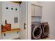 This mudroom has a built-in bench, coat hooks, and a sliding barn door to the laundry room at 3539 Habenaria Rd # 28, Mount Pleasant, SC 29466