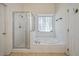 Bright bathroom featuring separate shower and tub with stylish tile and fixtures at 3872 James Bay Road Rd, Johns Island, SC 29455