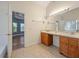 Bright bathroom boasts double sinks, spacious countertop, and tile flooring at 3872 James Bay Road Rd, Johns Island, SC 29455