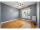 Cozy bedroom with hardwood floors, soft gray walls and a bright window view of the outside at 3872 James Bay Road Rd, Johns Island, SC 29455