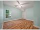 Bright bedroom featuring hardwood floors, closet, and light green paint at 3872 James Bay Road Rd, Johns Island, SC 29455