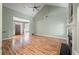 Bright, open living room showcasing hardwood floors, a fireplace, and entryways to other rooms at 3872 James Bay Road Rd, Johns Island, SC 29455