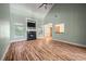 Living room with hardwood floors and fireplace that opens to dining area at 3872 James Bay Road Rd, Johns Island, SC 29455