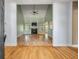 Open-concept living room featuring hardwood floors, a fireplace, and plenty of natural light at 3872 James Bay Road Rd, Johns Island, SC 29455