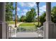 Open front porch view showcasing the green neighborhood and palm trees at 3872 James Bay Road Rd, Johns Island, SC 29455