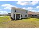 Spacious backyard featuring a screened-in porch and ample lawn space at 411 Bering Ln, Summerville, SC 29486