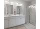 Clean bathroom includes double sinks, modern lighting, and a glass-enclosed shower at 411 Bering Ln, Summerville, SC 29486