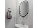 Powder room features a modern sink, rounded mirror, and stylish towel rack at 411 Bering Ln, Summerville, SC 29486