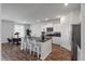 Open-concept kitchen featuring an island with seating and stainless steel appliances at 411 Bering Ln, Summerville, SC 29486