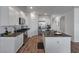 Modern kitchen with white cabinetry, granite countertops, and stainless steel appliances at 411 Bering Ln, Summerville, SC 29486