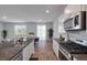 Modern kitchen features stainless steel appliances, granite countertops, and an open layout at 411 Bering Ln, Summerville, SC 29486