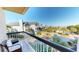 Relaxing balcony view with ocean views, a chair, and lush tropical landscaping at 4209 Ocean Club Dr, Isle of Palms, SC 29451