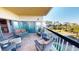 Inviting condo balcony featuring comfortable seating with views of the ocean and the surrounding community at 4209 Ocean Club Dr, Isle of Palms, SC 29451