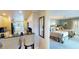 A view of the bedroom with two beds and stylish decor adjacent to the kitchen area at 4209 Ocean Club Dr, Isle of Palms, SC 29451