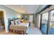 Comfortable bedroom featuring two beds, outdoor access, and a private bathroom at 4209 Ocean Club Dr, Isle of Palms, SC 29451