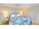 Comfortable bedroom with patterned duvet, decorative pillows and twin end table lamps at 4209 Ocean Club Dr, Isle of Palms, SC 29451
