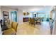 Bright dining area offering comfortable seating and open views into the living room and balcony at 4209 Ocean Club Dr, Isle of Palms, SC 29451