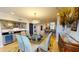 Elegant dining area with ample seating, a stylish chandelier, and a convenient bar area at 4209 Ocean Club Dr, Isle of Palms, SC 29451
