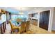 Bright dining space with elegant furnishings, a bar area, and seamless connection to other living areas at 4209 Ocean Club Dr, Isle of Palms, SC 29451