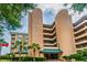 Exterior view of condo with cylindrical tower features and palm tree landscaping at 4209 Ocean Club Dr, Isle of Palms, SC 29451