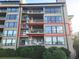 Exterior view of multi-story condo building with balconies overlooking greenery at 4209 Ocean Club Dr, Isle of Palms, SC 29451