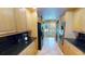 Well-equipped kitchen featuring sleek black countertops and stainless steel appliances at 4209 Ocean Club Dr, Isle of Palms, SC 29451