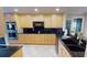 Well-equipped kitchen featuring sleek black countertops and stainless steel appliances at 4209 Ocean Club Dr, Isle of Palms, SC 29451