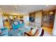 Comfortable living room boasts stylish seating, built-in storage, and seamless flow to dining area at 4209 Ocean Club Dr, Isle of Palms, SC 29451