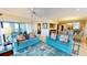 Bright living room with comfortable seating, wet bar, and dining area, perfect for gatherings and relaxation at 4209 Ocean Club Dr, Isle of Palms, SC 29451