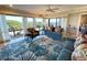 Inviting living room with beautiful ocean views from large windows and stylish furnishings creating a relaxing atmosphere at 4209 Ocean Club Dr, Isle of Palms, SC 29451
