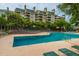 A large outdoor pool area featuring ample lounge seating and a well-maintained deck at 4209 Ocean Club Dr, Isle of Palms, SC 29451