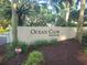 Entrance sign for Ocean Club Wild Dunes framed by lush greenery at 4209 Ocean Club Dr, Isle of Palms, SC 29451