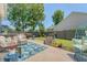Backyard patio with comfortable seating, a patterned outdoor rug, a privacy fence, and a well-manicured lawn at 422 Cabrill Dr, Charleston, SC 29414
