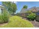 Landscaped backyard featuring a well-maintained lawn and a dark wood privacy fence for added seclusion at 422 Cabrill Dr, Charleston, SC 29414
