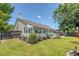 Well-kept backyard featuring an enclosed patio with ample seating and manicured lawn, ideal for relaxation at 422 Cabrill Dr, Charleston, SC 29414