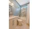 Bathroom featuring a marble vanity, decorative tile flooring, and a tub and shower combo with lovely marble wall accents at 422 Cabrill Dr, Charleston, SC 29414