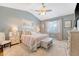 Bedroom with vaulted ceiling, neutral walls, ceiling fan, plush carpet, and a large bed with stylish bedding at 422 Cabrill Dr, Charleston, SC 29414