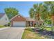 Charming brick home features a well-maintained lawn and a spacious two-car garage at 422 Cabrill Dr, Charleston, SC 29414