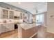 Bright, stylish kitchen with granite counters, white cabinetry, and adjoining breakfast nook at 422 Cabrill Dr, Charleston, SC 29414