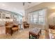 Inviting living room with leather seating, a light-filled window, and views into a modern kitchen at 422 Cabrill Dr, Charleston, SC 29414